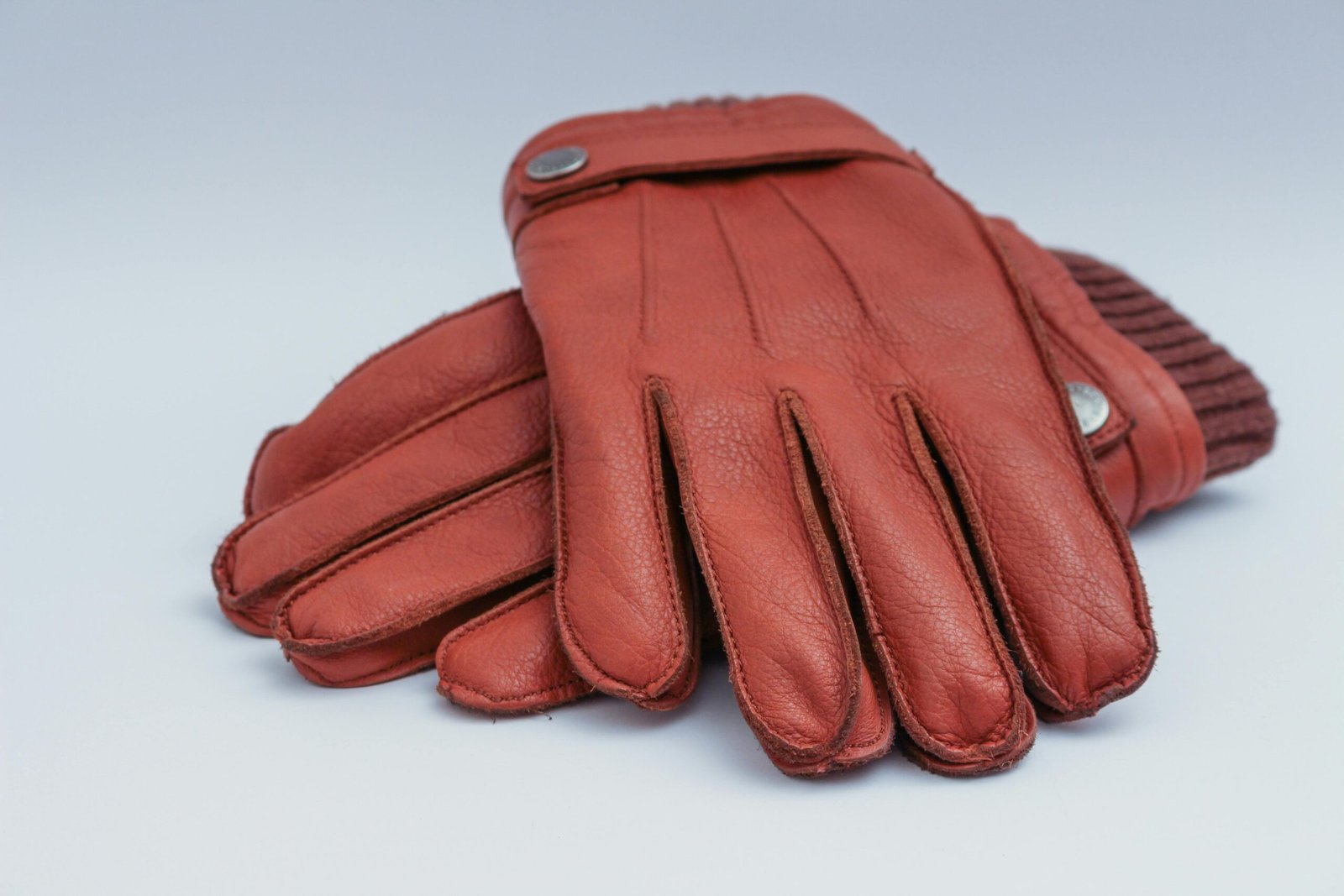 Close-up of brown leather gloves, perfect for winter fashion and warmth.